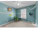Bedroom with painted walls, bright window, ceiling fan and artistic decor at 1007 Olde Midway Ct, Knightdale, NC 27545