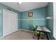 Bedroom with a closet, a bright window, ceiling fan, and a colorful accent wall at 1007 Olde Midway Ct, Knightdale, NC 27545