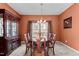 Formal dining room with a wooden table, chandelier, and traditional decor at 1007 Olde Midway Ct, Knightdale, NC 27545