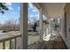 Charming porch with white railings, rocking chairs, and views of the surrounding neighborhood at 1007 Olde Midway Ct, Knightdale, NC 27545