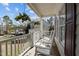 Cozy front porch featuring rocking chairs, hanging flowers, and a view of the neighborhood at 1007 Olde Midway Ct, Knightdale, NC 27545