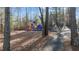 Community playground with colorful play structures and walking path at 1007 Olde Midway Ct, Knightdale, NC 27545