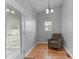Cozy sitting area with hardwood floors and a view to an outdoor patio at 1007 Olde Midway Ct, Knightdale, NC 27545
