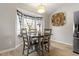 Dining area filled with natural light, showcasing a stylish table and bright window at 1033 Forest Glen Dr, Raleigh, NC 27603