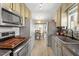 Well-equipped kitchen with modern appliances and adjoining dining area at 1033 Forest Glen Dr, Raleigh, NC 27603