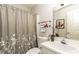Bathroom featuring a white sink vanity, a toilet and a tub with a shower curtain at 104 Province Cir, Rocky Mount, NC 27804