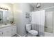 Bathroom featuring a white sink vanity, a toilet and a tub with a shower curtain at 104 Province Cir, Rocky Mount, NC 27804
