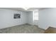 Spacious bedroom with neutral carpet, light blue walls, and a bright window at 104 Province Cir, Rocky Mount, NC 27804