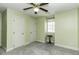 Bedroom featuring light green walls, neutral carpeting, a ceiling fan and a window at 104 Province Cir, Rocky Mount, NC 27804