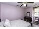 Bedroom featuring pink walls, neutral carpeting, a ceiling fan and a window at 104 Province Cir, Rocky Mount, NC 27804