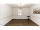 Dining room with a chandelier and natural light from the window at 104 Province Cir, Rocky Mount, NC 27804