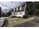 Attractive two-story home featuring dormer windows and a brick chimney at 104 Province Cir, Rocky Mount, NC 27804