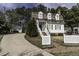 Quaint home with a well-kept lawn and a welcoming white picket fence at 104 Province Cir, Rocky Mount, NC 27804