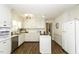 Well-lit kitchen featuring hardwood floors, an island, and ample storage at 104 Province Cir, Rocky Mount, NC 27804