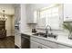 This bright kitchen features stainless steel appliances and white cabinets for a clean look at 104 Province Cir, Rocky Mount, NC 27804