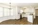 Bright kitchen featuring hardwood floors and white cabinetry at 104 Province Cir, Rocky Mount, NC 27804