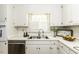 Bright kitchen with stainless steel dishwasher, a double sink, and white cabinets at 104 Province Cir, Rocky Mount, NC 27804