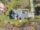 Aerial view shows backyard and roof; a deck and manicured landscaping add curb appeal at 106 Legault Dr, Cary, NC 27513