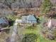 Attractive two-story home has lush landscaping, a large yard, and a paved driveway at 106 Legault Dr, Cary, NC 27513