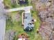 Aerial view of the house shows the roof, screened-in back porch, and lush landscaping at 106 Legault Dr, Cary, NC 27513