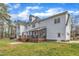 Expansive view of the home's back exterior with a spacious deck and screened porch at 106 Legault Dr, Cary, NC 27513