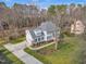 Charming two-story home with a well-maintained lawn and mature trees offers scenic views at 106 Legault Dr, Cary, NC 27513