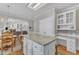 Open kitchen layout with a center island, breakfast bar seating, and a view into the living room at 106 Legault Dr, Cary, NC 27513