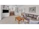 Living room featuring a brick fireplace, built-in shelving, and comfortable seating at 106 Legault Dr, Cary, NC 27513