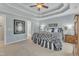Elegant main bedroom showcasing stylish decor, a trey ceiling, and comfortable carpeting at 106 Legault Dr, Cary, NC 27513