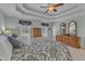 Well-lit main bedroom with a trey ceiling, dresser and mirrors, and neutral carpet at 106 Legault Dr, Cary, NC 27513