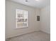 Cozy bedroom with a bright window and neutral walls and carpet at 110 Darley Dale Loop, Apex, NC 27502