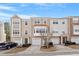 Charming multi-level townhomes with attached garages, manicured lawns, and inviting curb appeal at 110 Darley Dale Loop, Apex, NC 27502