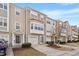 Charming multi-level townhomes with attached garages, manicured lawns, and inviting curb appeal at 110 Darley Dale Loop, Apex, NC 27502