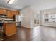 Well-equipped kitchen flowing into a dining area with views of the outdoor deck at 110 Darley Dale Loop, Apex, NC 27502