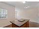 Bright kitchen island offering views to the adjacent dining space and outdoor living at 110 Darley Dale Loop, Apex, NC 27502