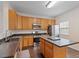 Kitchen featuring stainless appliances, a functional center island, and modern fixtures at 110 Darley Dale Loop, Apex, NC 27502