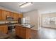 Open kitchen and dining area showcasing modern stainless steel appliances at 110 Darley Dale Loop, Apex, NC 27502