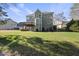Expansive backyard with a wooden deck, perfect for outdoor entertaining and relaxation at 1104 Fanning Dr, Wake Forest, NC 27587