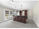 Spacious basement featuring a wet bar with wine rack and convenient access to the outdoors at 1104 Fanning Dr, Wake Forest, NC 27587