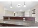 Granite countertop of basement bar overlooking open-concept living area with ample natural light at 1104 Fanning Dr, Wake Forest, NC 27587