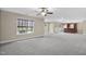 Open basement layout featuring neutral paint colors, carpet flooring, and a wet bar for entertaining at 1104 Fanning Dr, Wake Forest, NC 27587