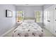 Cozy bedroom featuring carpet, natural light, and a double door closet at 1104 Fanning Dr, Wake Forest, NC 27587