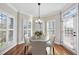 Cozy breakfast nook with plantation shutters, hardwood floors, and bright natural light at 1104 Fanning Dr, Wake Forest, NC 27587