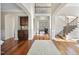 Grand foyer featuring hardwood floors, staircase, and elegant architectural details at 1104 Fanning Dr, Wake Forest, NC 27587