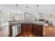 Open concept kitchen with breakfast bar, granite countertops, and stainless steel appliances at 1104 Fanning Dr, Wake Forest, NC 27587