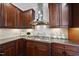 Gourmet kitchen features custom cabinets, stainless steel appliances, and sleek countertops at 1104 Fanning Dr, Wake Forest, NC 27587