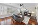 Inviting living room features hardwood floors, fireplace, and natural light from the large windows at 1104 Fanning Dr, Wake Forest, NC 27587