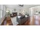 Comfortable living room with hardwood floors, a stone fireplace, and ample natural light, perfect for gatherings at 1104 Fanning Dr, Wake Forest, NC 27587