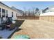 Extensive backyard with seating, privacy fence, and a large expanse of grass at 120 Wise Oak Ln, Garner, NC 27529