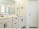 Bathroom features a double sink vanity with modern fixtures and tile backsplash at 120 Wise Oak Ln, Garner, NC 27529
